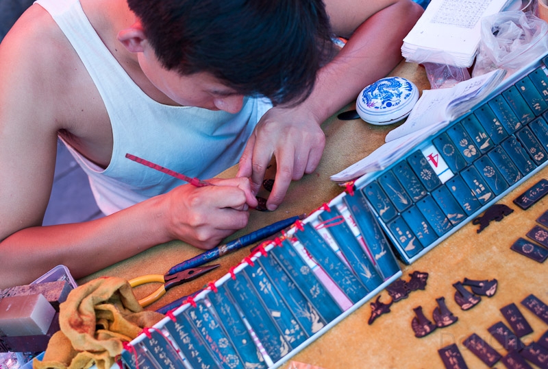 L1009855.jpg - Carving bamboo with figures and names