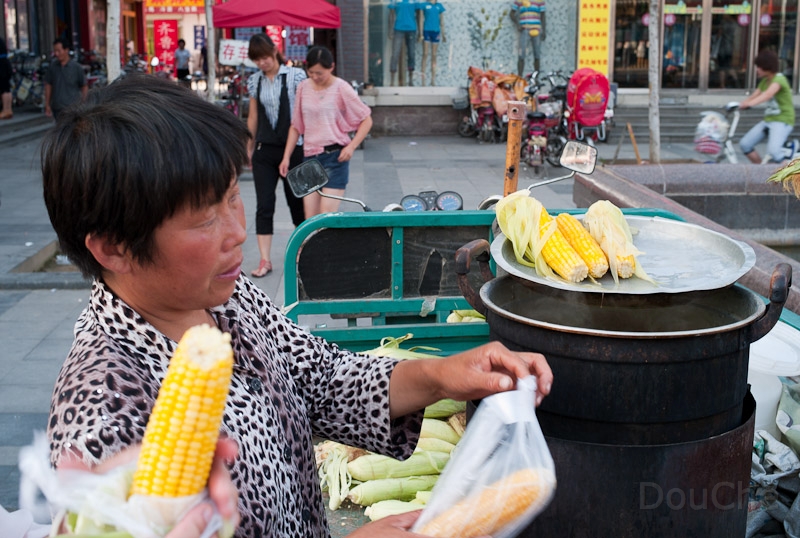L1009860.jpg - Selling corn sticks